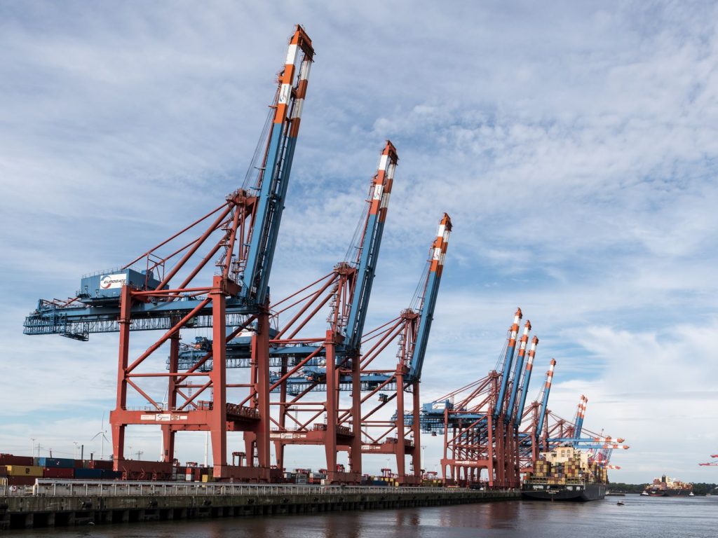 Container cranes and port logistics handling new car export from China