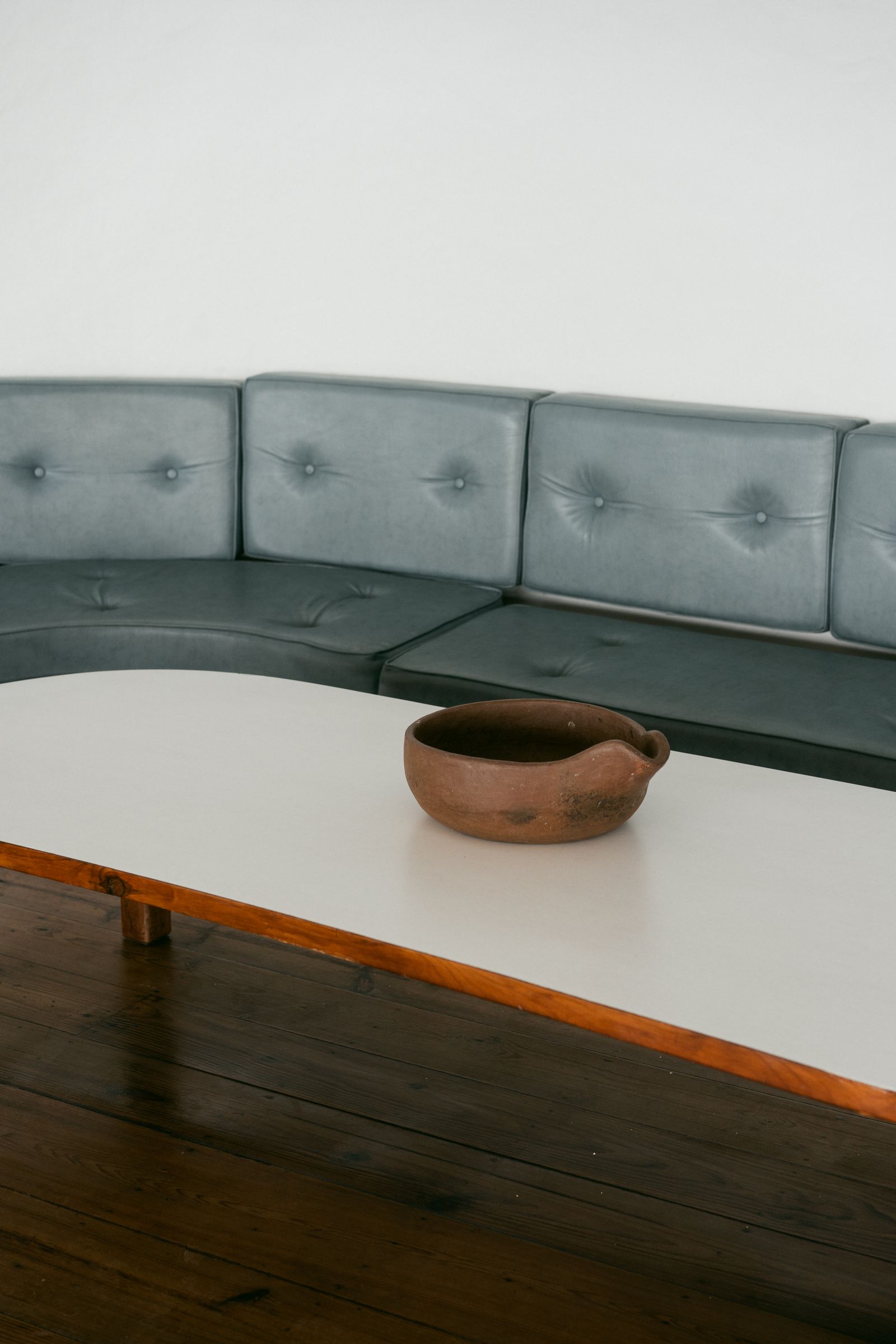Curved contemporary compressed sofa with sculptural lines