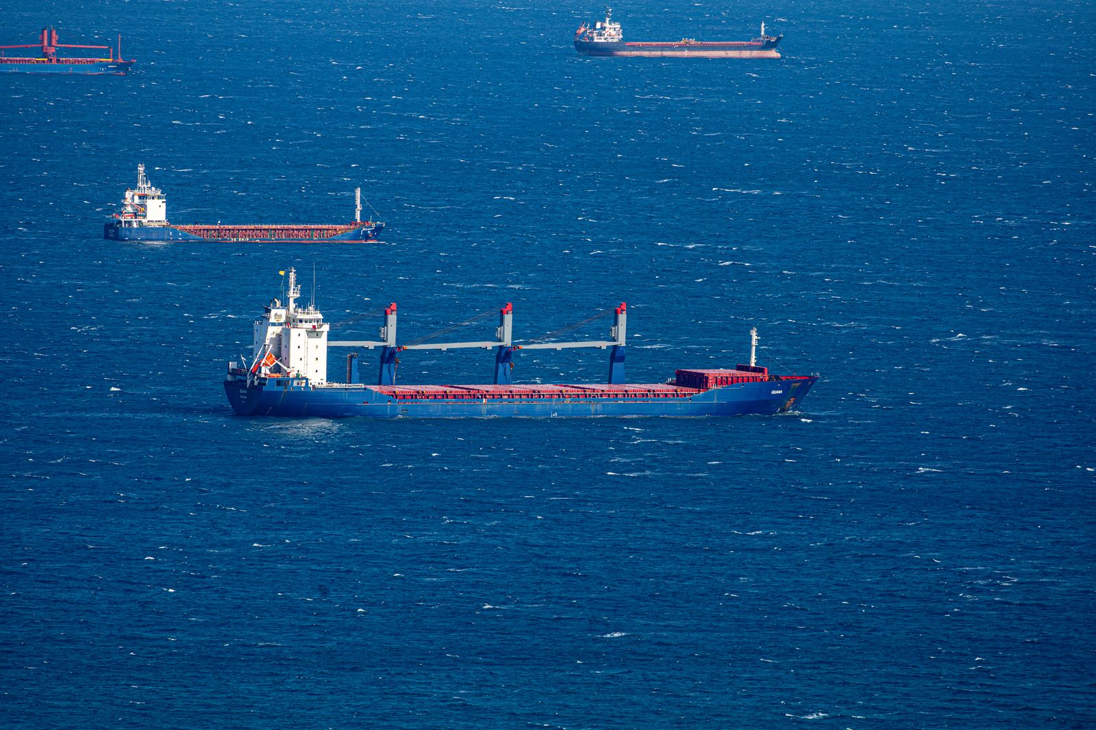 Cargo vessels carrying vehicles from China to global export destinations