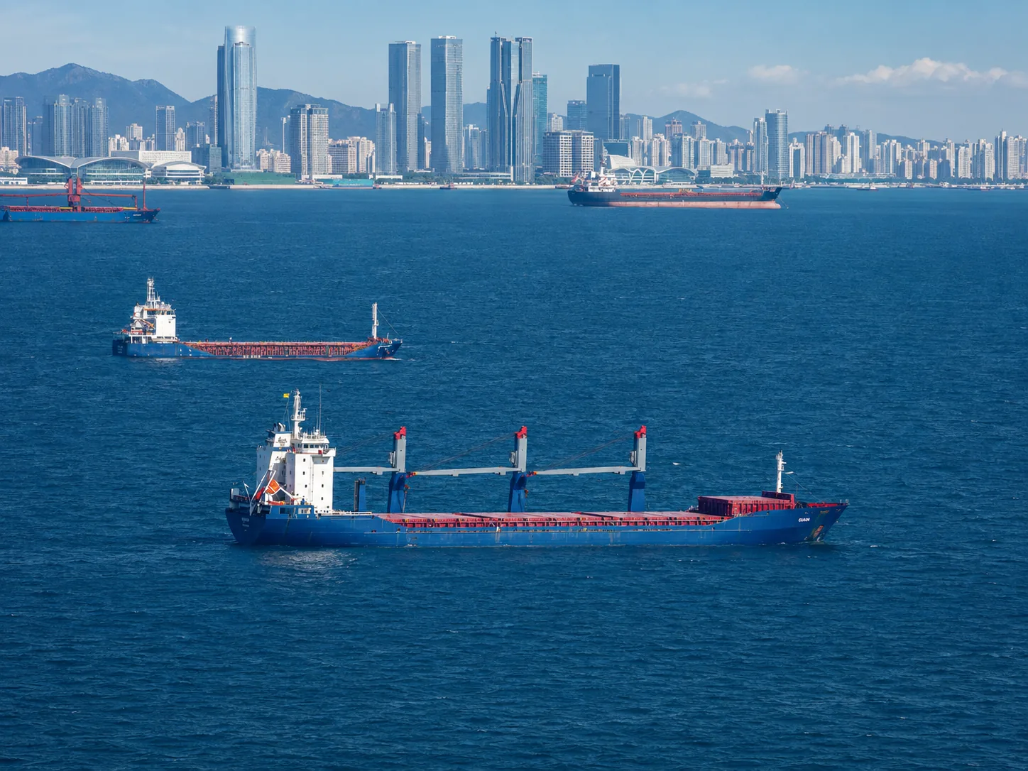 Cargo vessels carrying vehicles from China to global export destinations